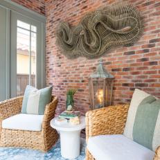Cottage Sitting Room With Exposed Brick Wall