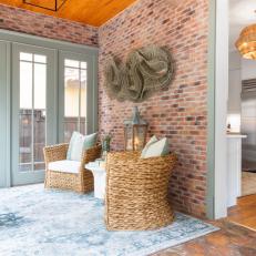 Neutral Transitional Sitting Area With Exposed Brick Walls
