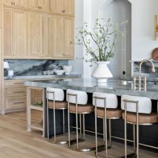 Neutral Contemporary Chef Kitchen With Gray Backsplash