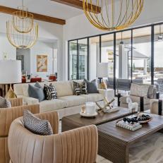Neutral Contemporary Living Area With Gold Pendants