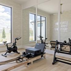 Neutral Transitional Home Gym With Neon Sign