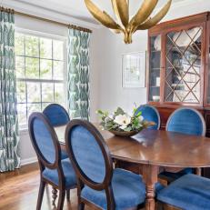 Transitional Dining Room With Gold Chandelier