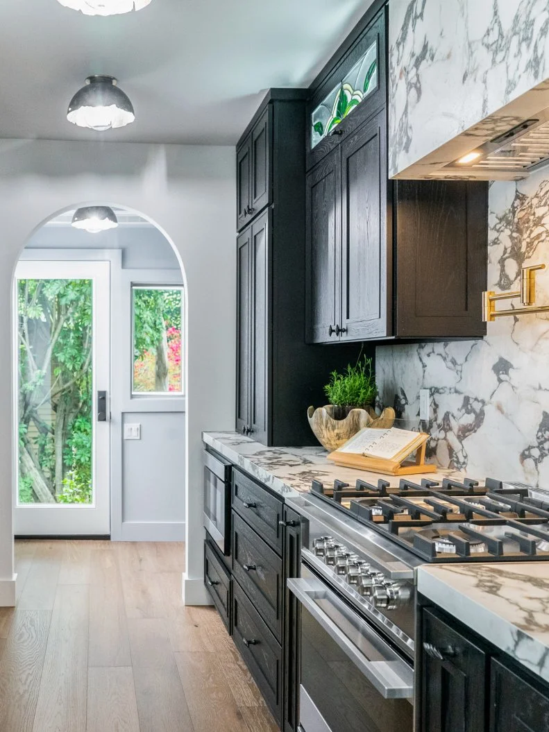 Tyra Banks, alongside Drew and Jonathan Scott, as they reveal the renovated spaces to Tyra's longtime high school friend, Marisa, as seen on Celebrity IOU.