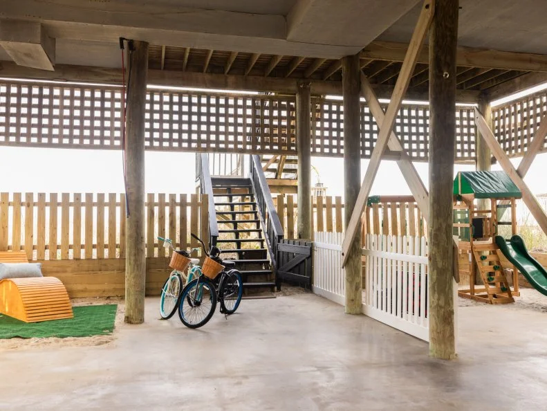 After of Team Sarah Baeumler’s exterior renovation that included adding a playground, bikes and sitting area, as seen on Battle on the Beach, Season 5.