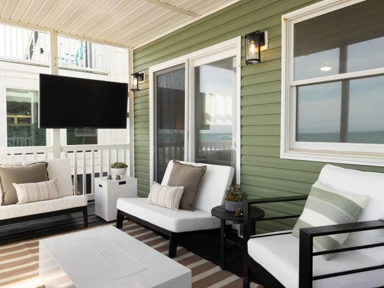 After of Team Sarah Baeumler’s back deck renovation that includes a living area, as seen on Battle on the Beach, Season 5.