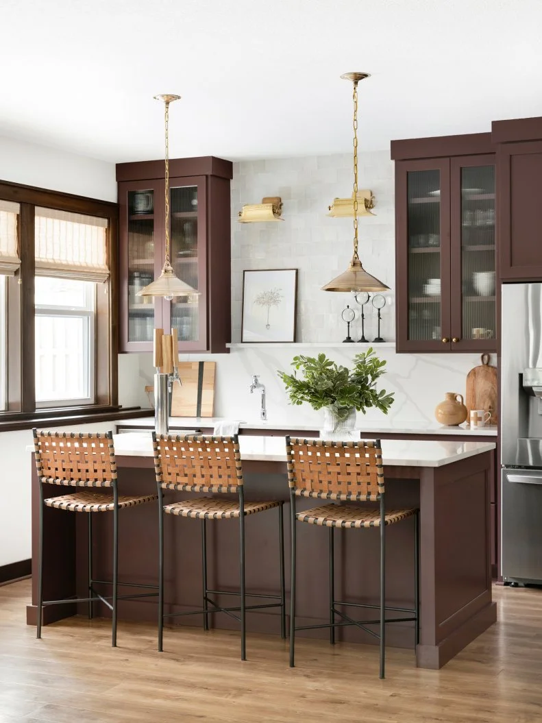 White and Brown Kitchen With Woven Stools and Brass Accents