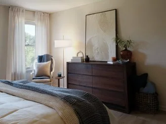 Shot of dresser in bedroom after renovations as seen on Totally 90s House, Season 1.