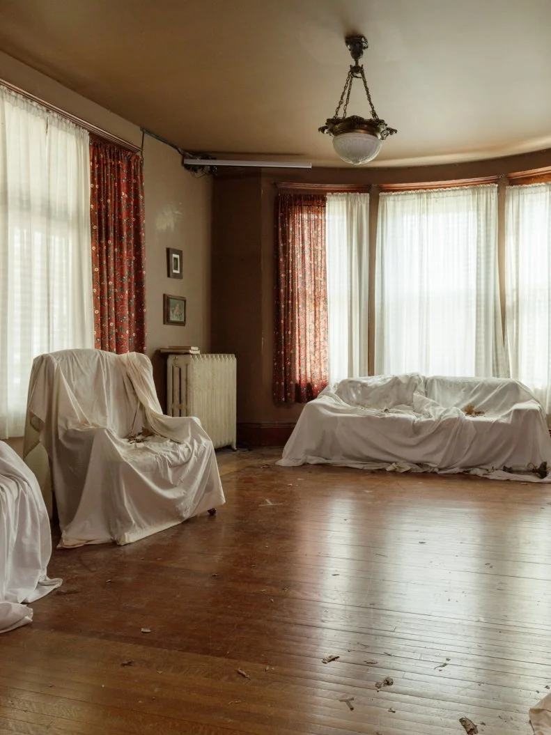 Before of the Bihl Manor living room, as seen on A Very Haunted Renovation, Season 1.