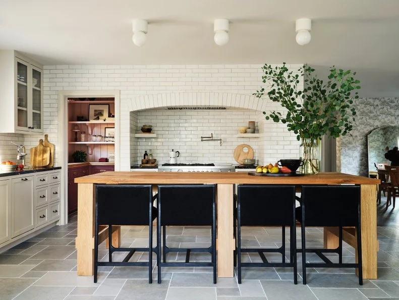 White Kitchen With Subway Tile and a White Oak Island