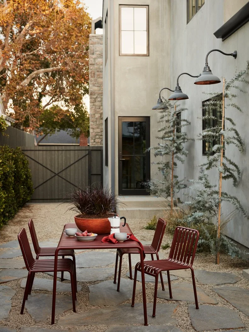 Patio Dining Area With Red Metal Furniture