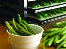 Whether you want to preserve your garden harvest or make healthy snacks for school lunches, discover how handy a food dehydrator can be and find out which model is right for you.