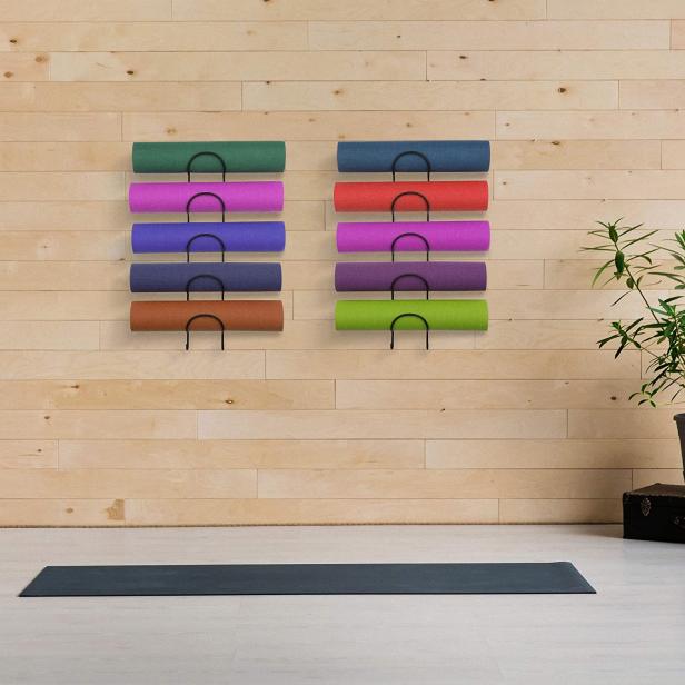 Shelf of work out equipment in modern gym. Yoga, classes