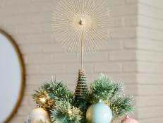 From classic sparkling stars to a light-up Star Wars Death Star, shop our favorite Christmas tree topper ideas for every budget and design style.