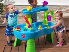 Keep your little ones cool and busy for hours on end with these outdoor water tables, sand tables and mud kitchens.