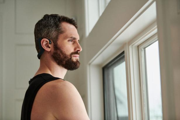 Portrait of professional basketball player Kevin Love using Cove, a breakthrough new wearable tech device that helps users get better sleep, clarity and focus, while helping to lower their stress and anxiety.
