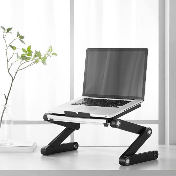 https://hgtvhome.sndimg.com/content/dam/images/hgtv/products/2023/1/20/rx_amazon_urban-shop-adjustable-multi-position-folding-sit-and-stand-vented-laptop-desk-stand.jpeg.rend.hgtvcom.616.616.suffix/1674254071419.jpeg