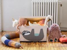 Put those cuddly companions in their place, once and for all, with our favorite toy bins, baskets, bookshelves and hammocks.