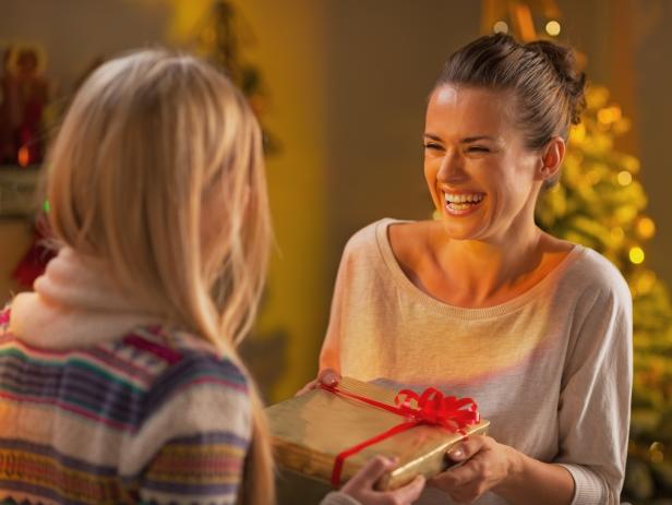 Two girlfriends exchanging christmas presents