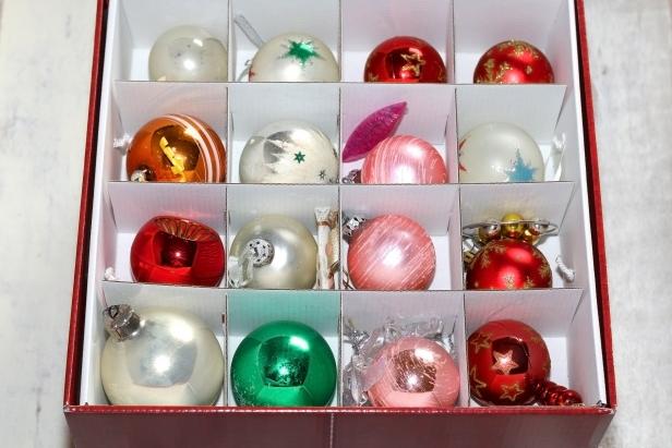 Colorful retro Christmas ornaments organized in a box. Selective focus.