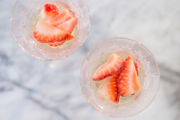 Champagne Cocktail Garnished With Strawberries