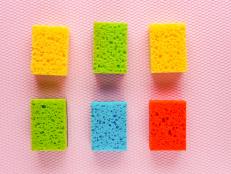 Colorful kitchen cleaning set sponge background