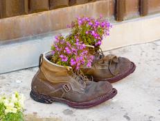 For a more creative approach to potted plants, consider upcycling a pair of old boots into unique flower pots.
