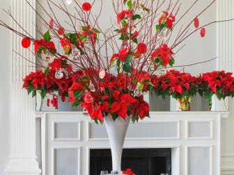 THE URBAN FLOWER FIRM (TUFF) : DINING TABLE IN WHITE SETTING DECORATED WITH WHITE VASE CENTRE PIECE FILLED WITH POINSETTIA 'CHRISTMAS FEELINGS RED'