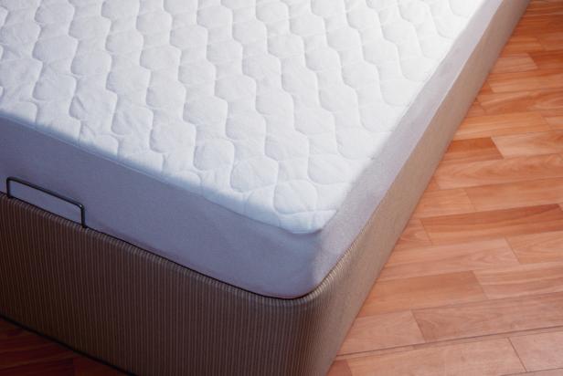 how to clean a mattress: use a fitted cover