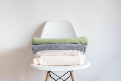 https://hgtvhome.sndimg.com/content/dam/images/hgtv/stock/2023/11/0/Getty-Images_1364273364_Alena-Shafieva_folded-towels.jpg.rend.hgtvcom.406.271.suffix/1698946771842.jpeg