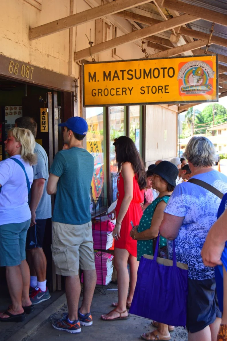 Haleiwa, HI, USA August 1 Folks form a long line, out the door, for shave ice at Matsumoto General Store in Haleiwa, Hawaii