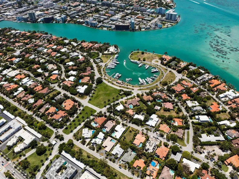 Aerial view of houses, hotels, buildings, boats, marina, Indian Creek in South Beach Miami Florida on a beautiful sunny day, United States of America