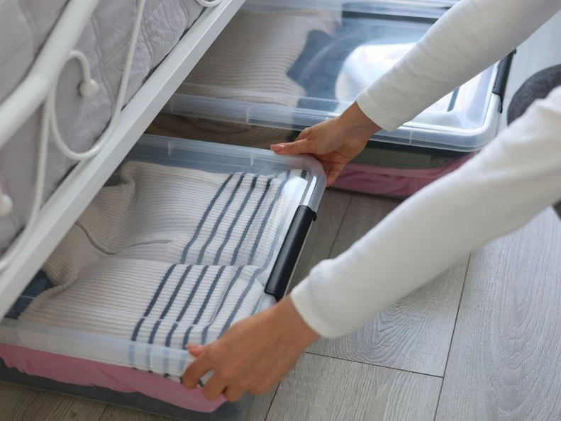 Effectively Organizing and Storing Clothes Under the Bed Using Clear Storage Boxes for Clarity
