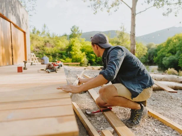 man working on building a deck