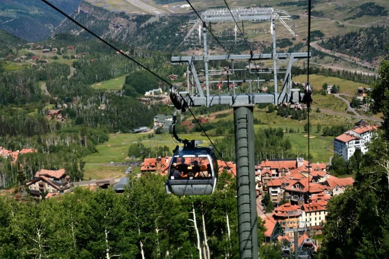 TELLURIDE, CO - JULY 8, 2014: The Colorado towns of Telluride and Mountain Village are linked by a gondola, the first and only free public transportation system of its kind in the United States. Skiers, visitors and mountain bikers have used the gondola for free transportation between the two towns since 1996. (Photo by Robert Alexander/Getty Images)