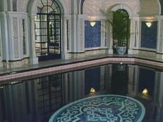 This elegant pool features regal classical design and an underwater mosaic.