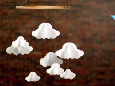 Add dreamy style to your baby's nursery with this budget-friendly DIY cloud mobile made from an embroidery hoop and our free downloadable template.