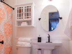 As seen on Beach Flip, Contestants Sarah and Nick renovated the second floor guest bedroom with new tile, lighting and a pedestal sink at the Gulf Dreams condo. (after)