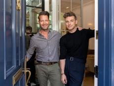 As seen on HGTV’s Starting Over with Nate and Jeremiah, Nate Berkus and Jeremiah Brent pose by their front door. (At Home)